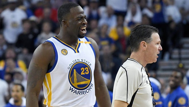 Draymond Green complains to official Pat Fraher.
