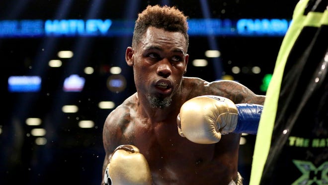 Jermell Charlo, left, in action against Charles Hatley during their fight Saturday.