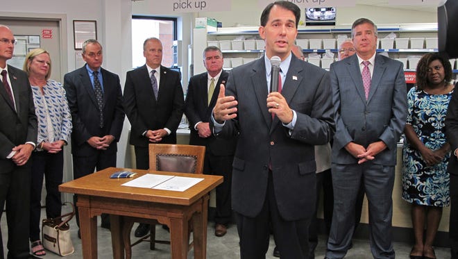 Gov. Scott Walker announced the creation of a state task force to address the Wisconsin's troubling increase in opioid abuse at a Walgreens pharmacy at 3522 W. Wisconsin Ave.