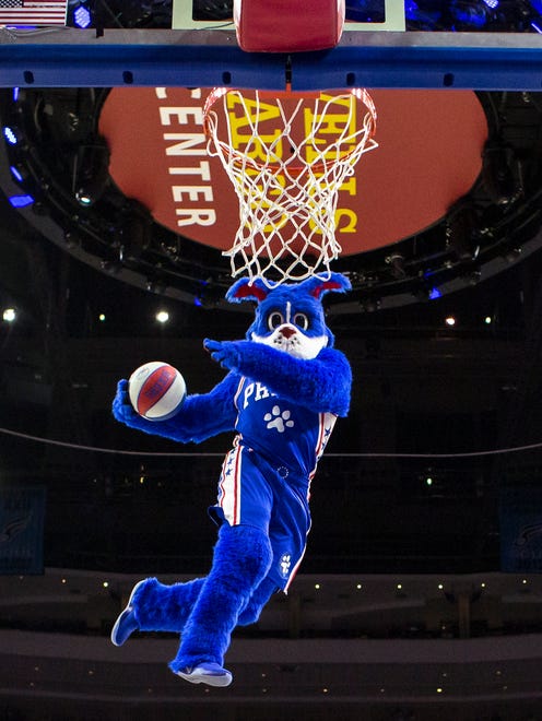 Philadelphia 76ers' mascot Franklin goes up for the dunk.
