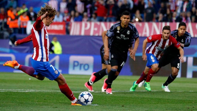 Atletico Madrid's Antoine Griezmann scores a penalty during a Champions League semifinal match against Real Madrid.