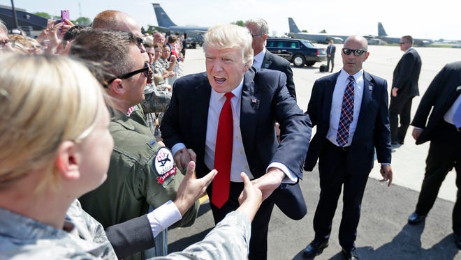 President Donald Trump greets supporters at the 128th Air Refueling Wing at 1919 E Grange Ave. near General Mitchell International Airport in Milwaukee.