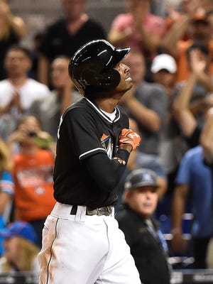 Dee Gordon reacts after hitting a solo home run in  the first inning.