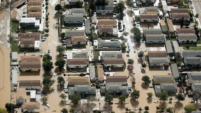 Floodwaters surround homes and cars on  in San Jose, Calif. Feb 22, 2017. 
Thousands of people were ordered to evacuate their homes as floodwaters inundated neighborhoods and forced the shutdown of a major highway.