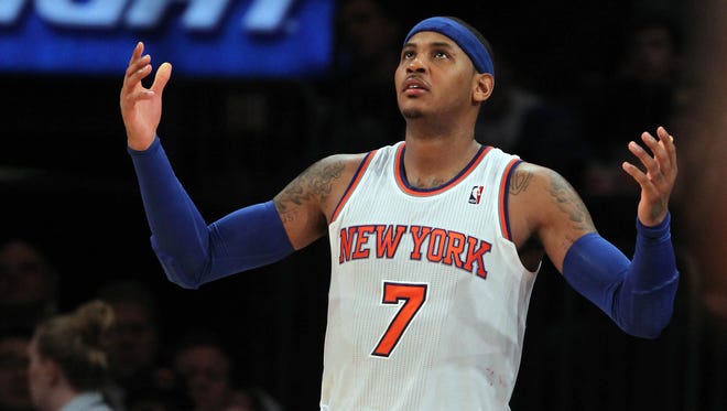 New York Knicks small forward Carmelo Anthony (7) reacts during the third quarter at Madison Square Garden.