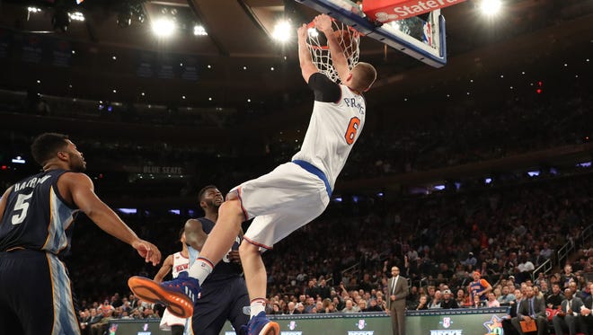 New York Knicks forward Kristaps Porzingis (6) dunks the ball during the third quarter against the Memphis Grizzlies at Madison Square Garden. New York Knicks won 111-104.