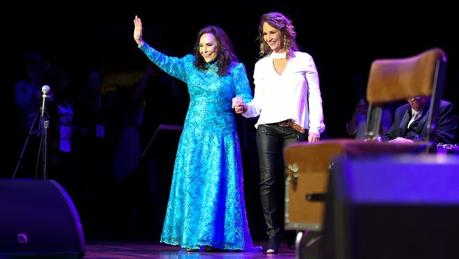 Loretta Lynn steps on the stage with her daughter Patsy Lynn before performing at the Ryman Auditorium Friday, April 14, 2017 in Nashville, Tenn.