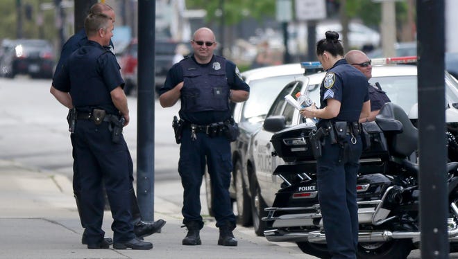 Police are seen outside the Hyatt Regency hotel on 333 W. Kilbourn Ave., in Milwaukee on Tuesday. President Donald Trump returns Tuesday afternoon to the Milwaukee-area where he was expected to talk about health care, tout job apprenticeships and raise cash for Gov. Scott Walker.
