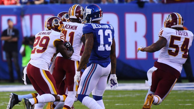 Washington Redskins players celebrate after a last-minute interception against the New York Giants.