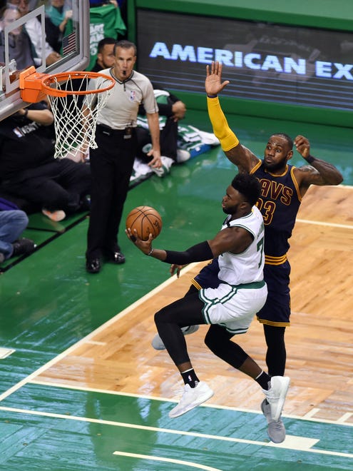 Celtics forward Jaylen Brown attempts a layup in front of LeBron James during the second quarter of Game 5 of the Eastern Conference finals.