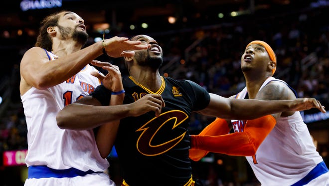 Tristan Thompson fights for position with Joakim Noah and Carmelo Anthony.