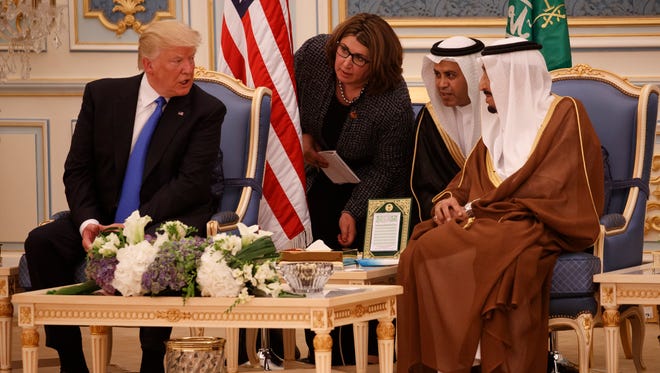 President Trump talks with Saudi King Salman during a presentation ceremony of The Collar of Abdulaziz Al Saud Medal at the Royal Court Palace on May 20, 2017, in Riyadh.