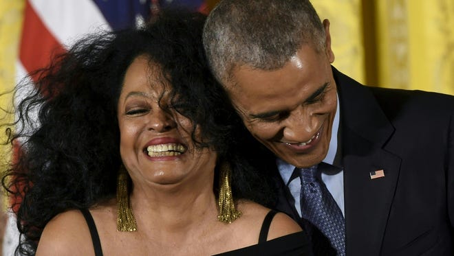 US President Barack Obama hugs vocalist and musician Diana Ross during presentation of the Presidential Medal of Freedom.