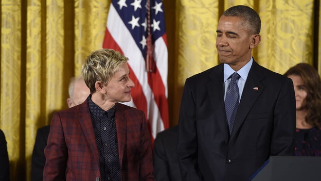 US President Barack Obama presents actress and comedian Ellen DeGeneres with the Presidential Medal of Freedom.