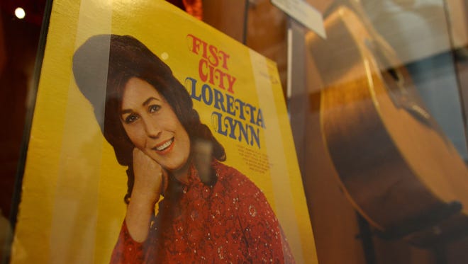 The "Loretta Lynn: Blue Kentucky Girl" exhibit opens Friday, August 25, 2017 at the Country Music Hall of Fame in downtown Nashville. Original album pressings, instruments, wardrobe and other artifacts were assembled for the tribute.