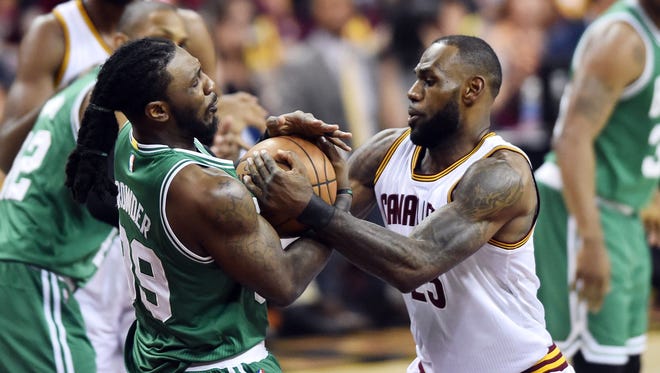 Boston Celtics forward Jae Crowder steals the ball from Cleveland Cavaliers forward LeBron James during the first quarter in Game 3 of the Eastern Conference finals.