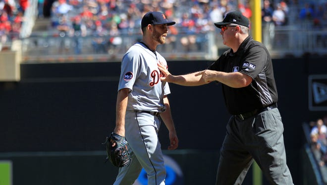 Tigers pitcher Matt Boyd is held back by first base umpire Mike Everitt in the fifth inning after the Twins' Miguel Sano pointed at Boyd following a hit-by-pitch April 22, 2017 at Target Field in Minneapolis.