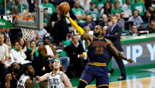 LeBron James (23) attempts a layup against the Boston Celtics during the third quarter of Game 5 of the Eastern Conference finals.