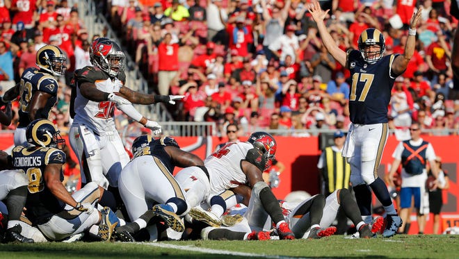 Rams quarterback Case Keenum (17) reacts after running back Todd Gurley (30) scores against the Buccaneers.