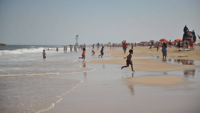 Kids play in the waves in Ocean City, Md., during Memorial Day weekend 2016.