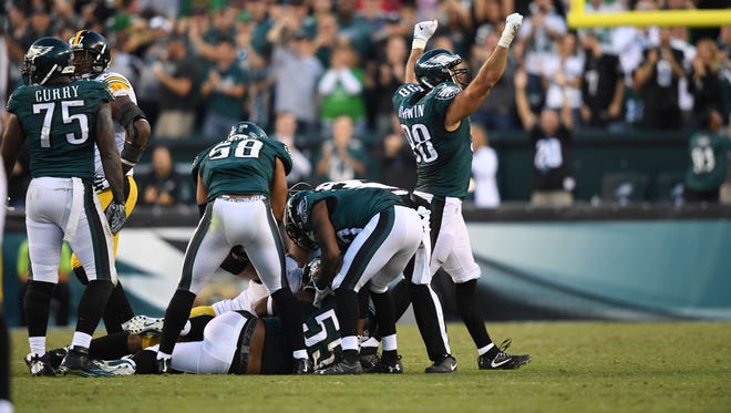 Eagles defensive end Connor Barwin (98) reacts after defensive end Brandon Graham (55) recovers a fumble against the Steelers.