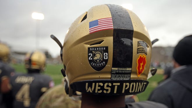 An Army player wears a helmet decal honoring defensive back Brandon Jackson, who died Sept. 11 in a single-car accident.
