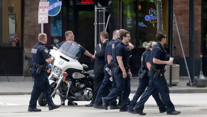 Police are seen outside the Hyatt Regency hotel on 333 W. Kilbourn Ave., in Milwaukee. President Donald Trump returns Tuesday afternoon to the Milwaukee-area where he was expected to talk about health care, tout job apprenticeships and raise cash for Gov. Scott Walker.