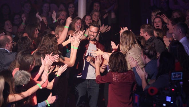 Nick Viall greets fans at the Pabst Theater during a Chris Lane concert filmed for the show on October 6.
