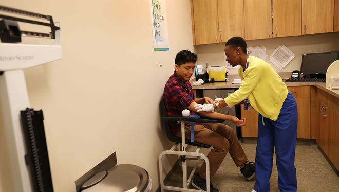 Peter Yanez, insured through the Affordable Care Act, receives a blood test.