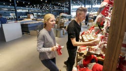Polly Gabriel, left, a Sendik's home merchandiser, and Bjorn Chinander, a Sendik's home designer work on stocking holiday related items in the Sendik's home department. Preparations were underway to open the new Sendik's Food Market on Miller Park Way, in West Milwaukee on Thursday, November 10, 2016. The store is set to open on November 15. Sendik's plans to open six stores in the next 12 months.