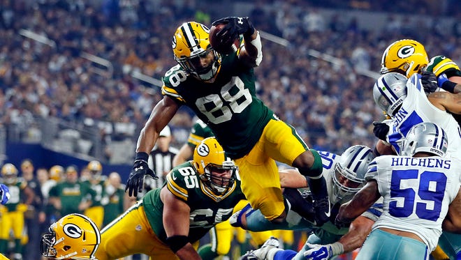 Green Bay Packers running back Ty Montgomery (88) dives for a touchdown during the second quarter against the Dallas Cowboys in the NFC Divisional playoff game at AT&T Stadium.