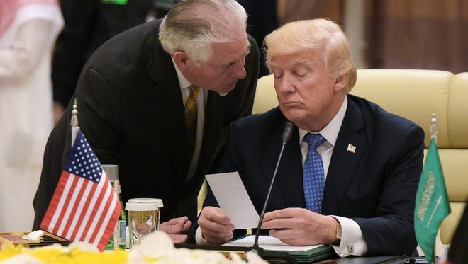 President Trump listens to Secretary of State Rex Tillerson during a meeting with leaders of the Gulf Cooperation Council in Riyadh on May 21, 2017.