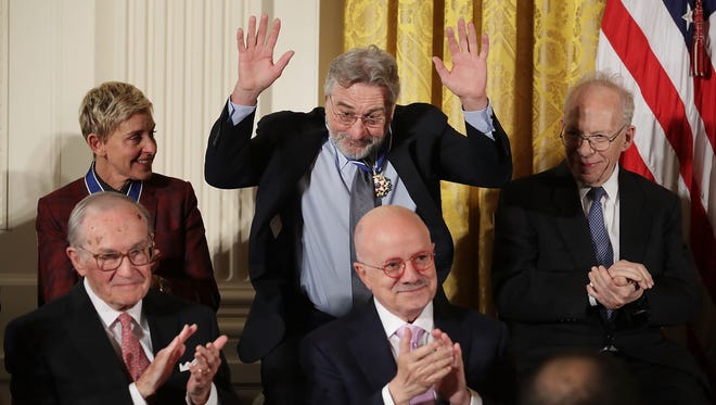 Motion picture legend and Oscar winner Robert De Niro reacts to applause after he was awarded the Presidential Medal of Freedom by U.S. President Barack Obama.