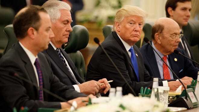 President Trump waits for the beginning of a bilateral meeting with Saudi King Salam at the Royal Court Palace, on May 20, 2017, in Riyadh. From left are, White House chief of staff Reince Priebus, Secretary of State Rex Tillerson, Trump, Commerce Secretary Wilbur Ross, White House senior adviser Jared Kushner, and Chief Economic Adviser Gary Cohn.