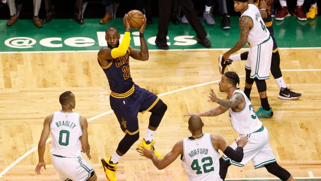 Cleveland Cavaliers forward LeBron James looks to pass against the Boston Celtics during the first quarter in Game 2 of the Eastern Conference finals.
