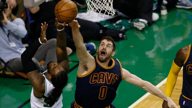 Boston Celtics forward Jae Crowder is defended by Cleveland Cavaliers forward Kevin Love during the first quarter in game one of the Eastern conference finals of the NBA Playoffs at TD Garden.