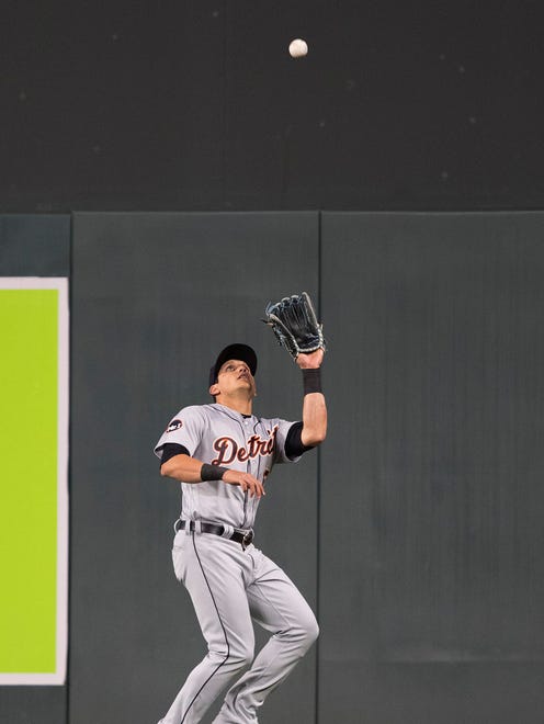 Tigers rightfielder Mikie Mahtook (15) catches a fly ball in the fourth inning of the Tigers' 6-3 loss Friday in Minneapolis.