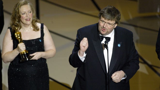 2003: Picking up documentary feature for " Bowling for Columbine, " outspoken filmmaker Michael Moore was booed when he railed against the Iraq War and President George W. Bush. “ Any time you ’ ve got the pope and the Dixie Chicks against you, your time is up, ” he said.