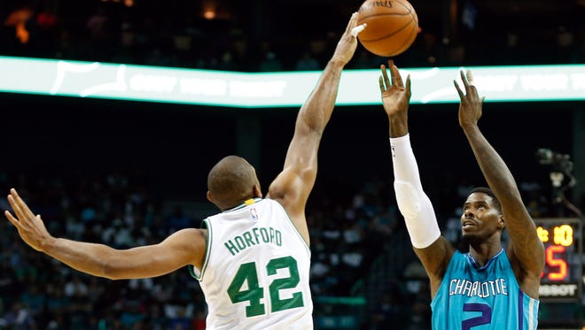 Boston Celtics center Al Horford (42) blocks the shot of Charlotte Hornets forward Marvin Williams (2) in the first half at the Spectrum Center