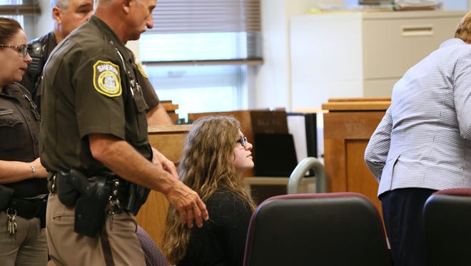Anissa Weier takes a seat Monday for her hearing in Waukesha County Circuit Court. Attorneys for Weier and Morgan Geyser, both 15, have asked that juries for their separate trials on charges of attempted first-degree intentional homicide, scheduled for the fall, be sequestered to prevent any chance of outside information influencing jurors. The Waukesha girls are charged as adults in 2014 stabbing of their sixth-grade classmate, who survived 19 stab wounds. The girls told police they committed the crime to impress or appease Slender Man, a fictional internet character.