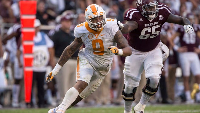 Oct 8, 2016; College Station, TX, USA; Tennessee Volunteers defensive end Derek Barnett (9) rushes past Texas A&M Aggies offensive lineman Avery Gennesy (65) during the second half at Kyle Field. The Aggies defeat the Volunteers 45-38 in overtime. Mandatory Credit: Jerome Miron-USA TODAY Sports ORG XMIT: USATSI-270342 ORIG FILE ID:  20161008_sal_an4_210.JPG