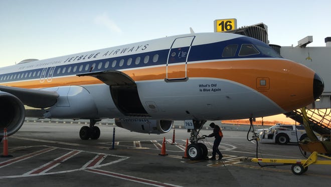JetBlue's specially themed Airbus A320 sits a gate at New York JFK on Nov. 11, 2016.