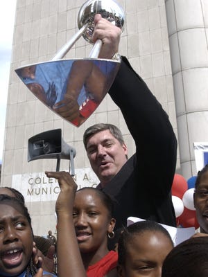 The Shock and coach Bill Laimbeer celebrate their 2003 WNBA championship at a rally in front of the Spirit of Detroit statue on the corner of Woodward and Jefferson in downtown Detroit.