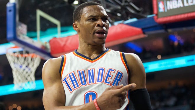 Russell Westbrook reacts to a fan.