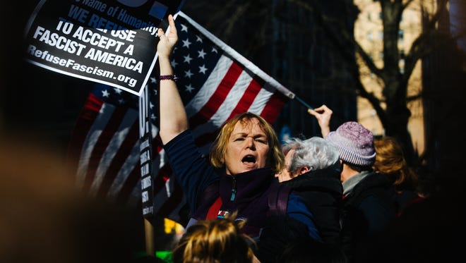 People protest against Donald Trump at the 'Not My Presidents Day' rally in New York.