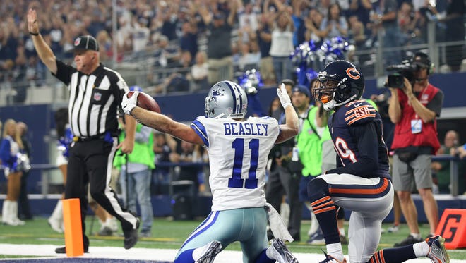 Cowboys receiver Cole Beasley (11) looks for the touchdown call from field judge Steve Zimmer (33) after a catch against the Bears.