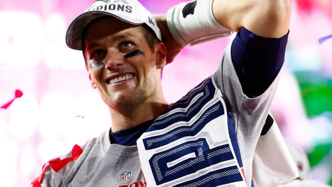 Brady celebrates winning his fourth title and third Super Bowl MVP with the Patriots' victory over the Seattle Seahawks in Super Bowl XLIX.