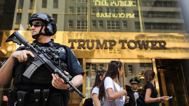 Police stand guard outside of Trump Tower on Aug. 4, 2017 in New York City. Following a dispute with the Trump Organization over a lease, the Secret Service, which protects all US presidents, has moved to a small trailer on a side street outside of Trump Tower. The federal agency had been renting office space in Donald Trump's Midtown Manhattan skyscraper since 2015 before a disagreement over the terms and costs for rent for a command post.