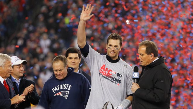 Brady celebrates with the Lamar Hunt Trophy after defeating the Pittsburgh Steelers in the 2016 AFC Championship Game at Gillette Stadium.