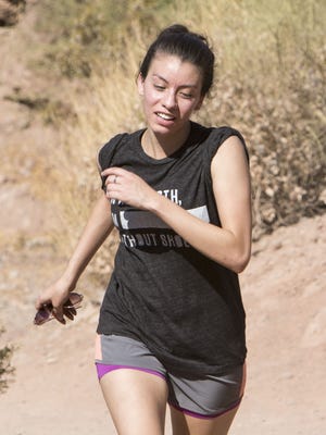 Sophia Montelongo finishes her hike at Echo Canyon Trail at Camelback Mountain in Phoenix on June 18, 2017.